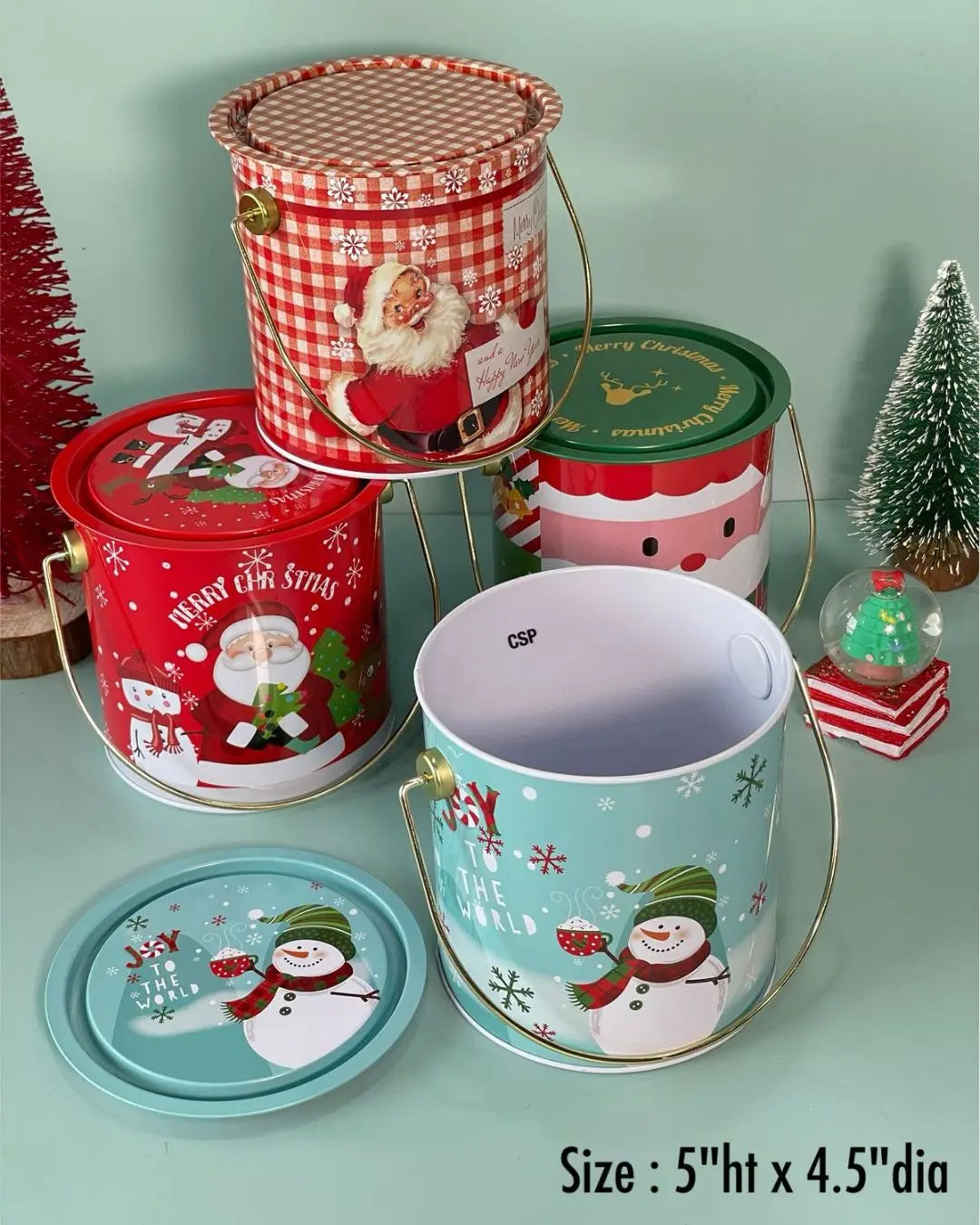 Christmas metal gift buckets with printed Santa designs and scalloped lids