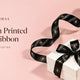 Custom printed logo satin ribbon tied on a white gift box
