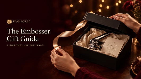 Personalised paper embosser in a black gift box with satin ribbon