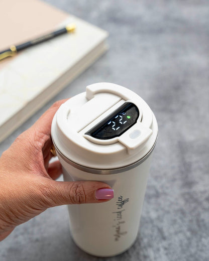 White smart thermal mug with illuminated digital display under open lid