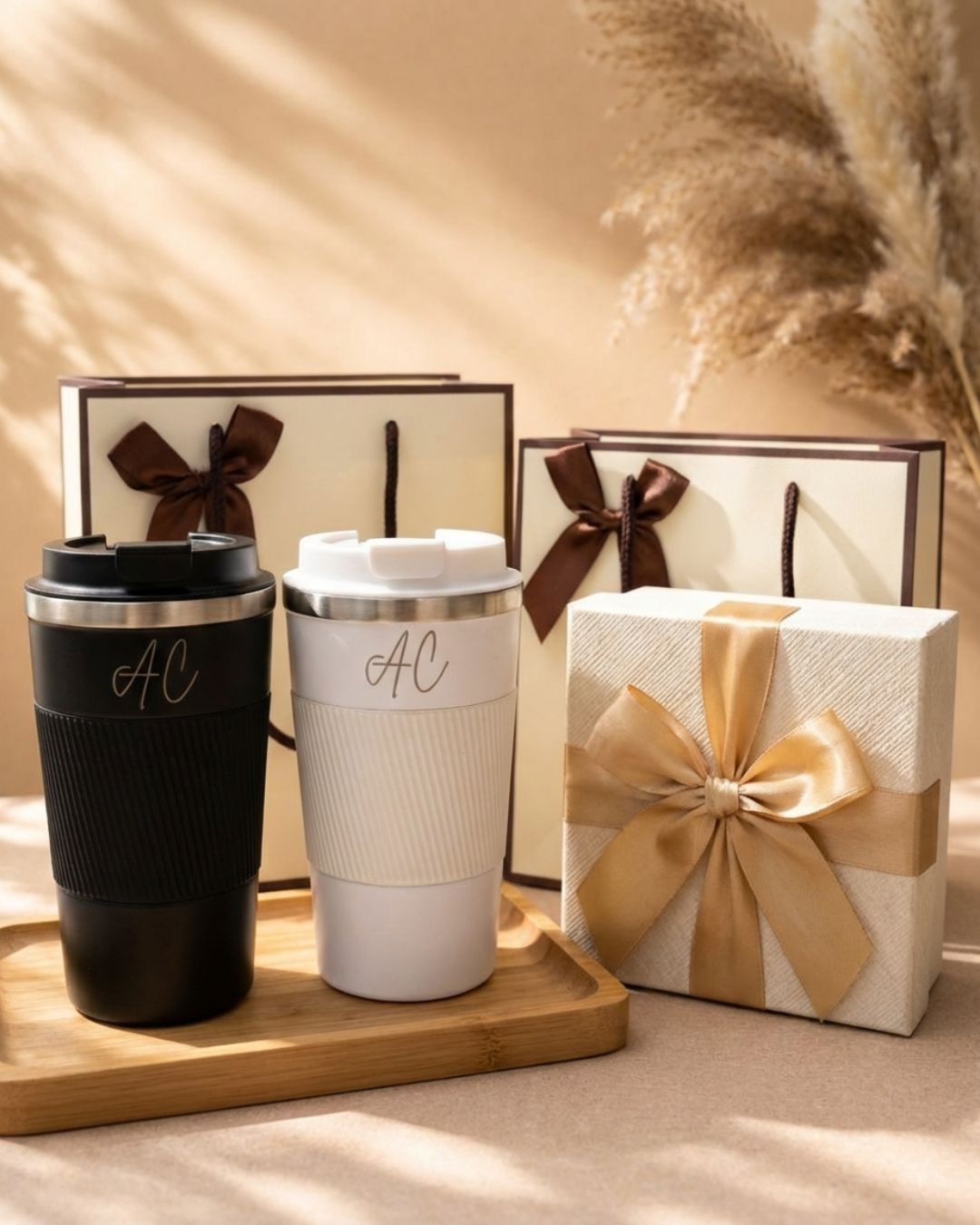 Black and white personalized travel mugs with AC initials and easy-hold top