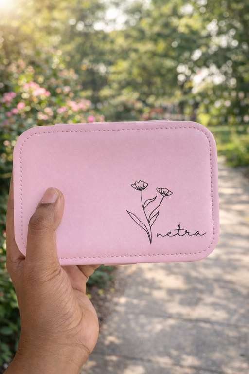 Pink jewelry box with flower design and name 'netra' on front