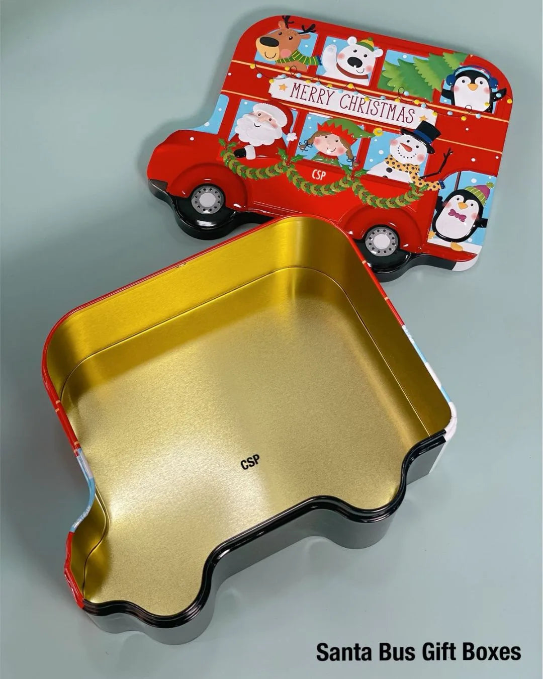 Santa bus car-shaped tin box with gold interior and red patterned lid