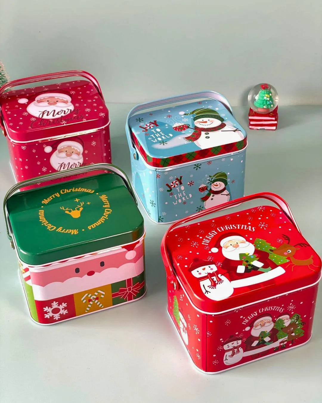 Merry Carry Box tin gift box set with handles: red, green, and blue designs