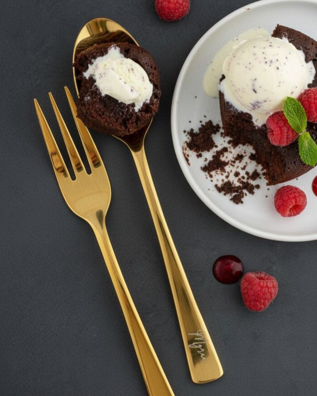 Gold engraved fork and spoon, with handle script detail
