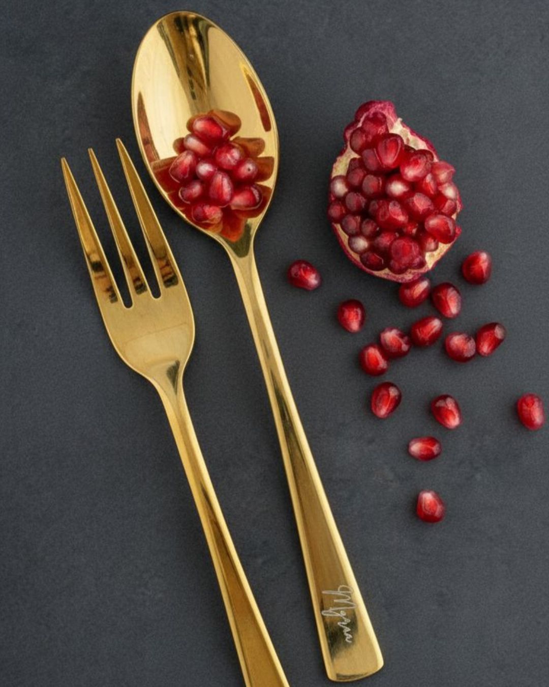 Gold flatware: engraved fork and spoon with polished finish