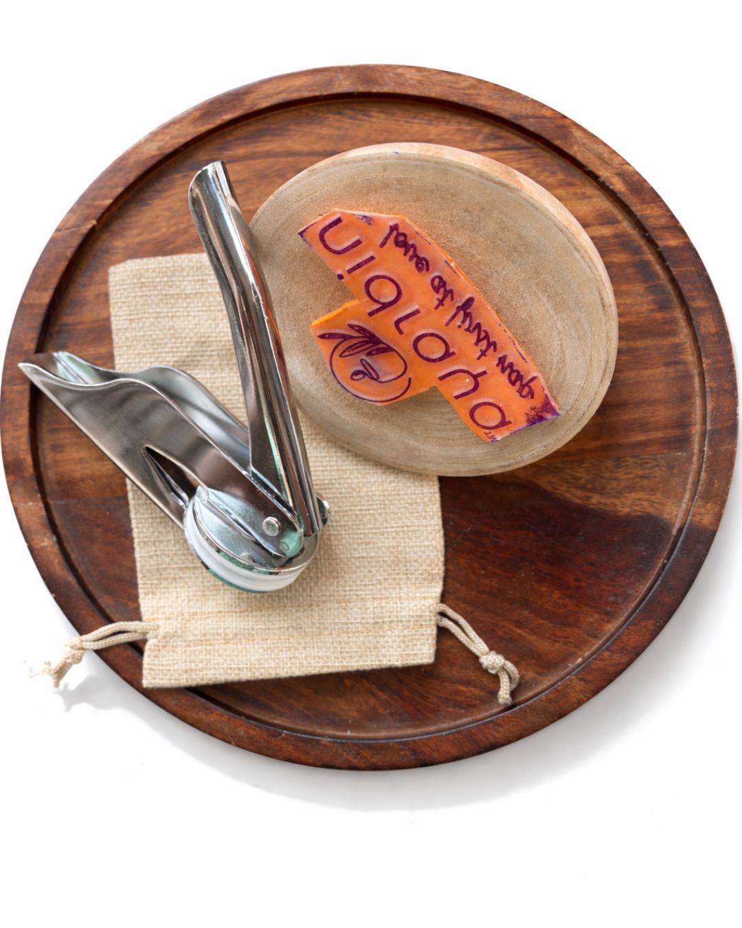 Personalized stationery set accessories on wooden base: pen and ink stamp in pouch
