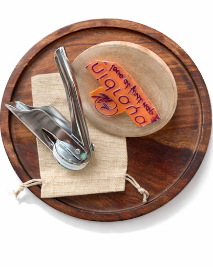 Personalized stationery set accessories on wooden base: pen and ink stamp in pouch