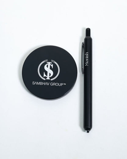 Signature Shaan Set: black logo coaster beside black pen